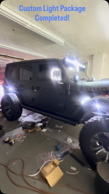 Our full spray Jeep named Rubi is nearing a completion! Check out the light package with Rigid rock lights in the fenders, light bar ,custom bezel, body light, turn signal, back up light,switches, and fuse panel.